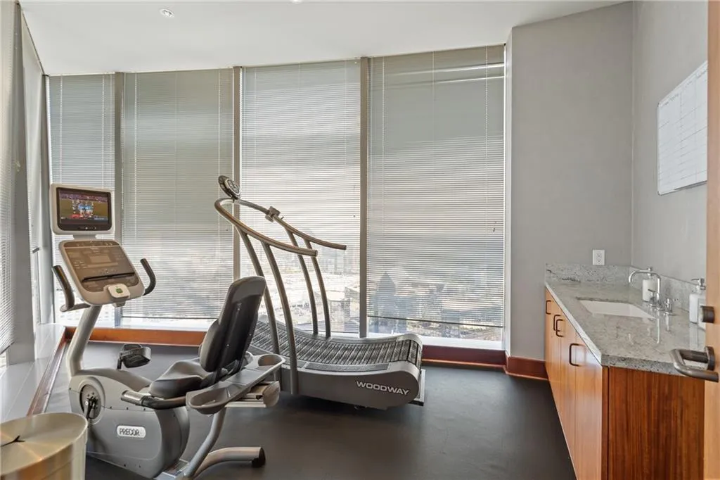 Workout room with a sink and expansive windows