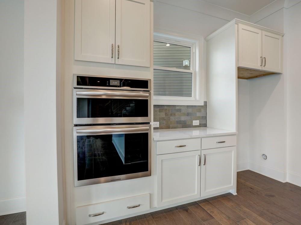 Views of the side of kitchen which has a window for natural light!