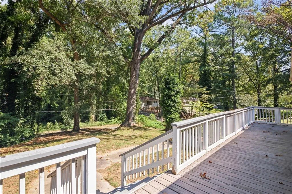 Deck with view of wooded area