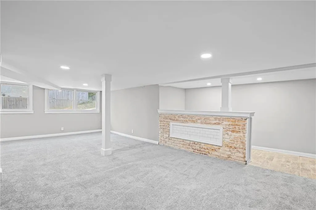 Basement featuring light carpet and recessed lighting