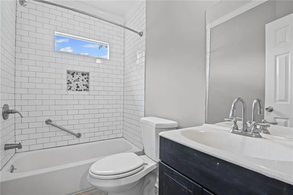 Full bathroom with bathtub / shower combination and vanity