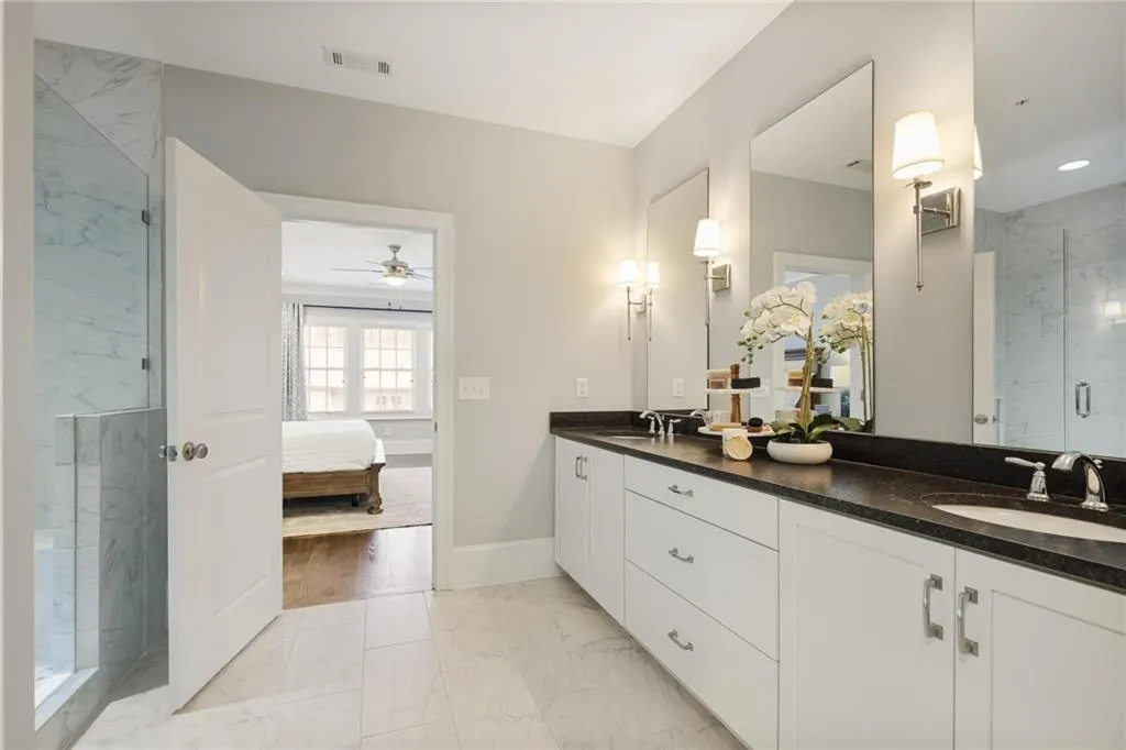 Primary bath with view to bedroom