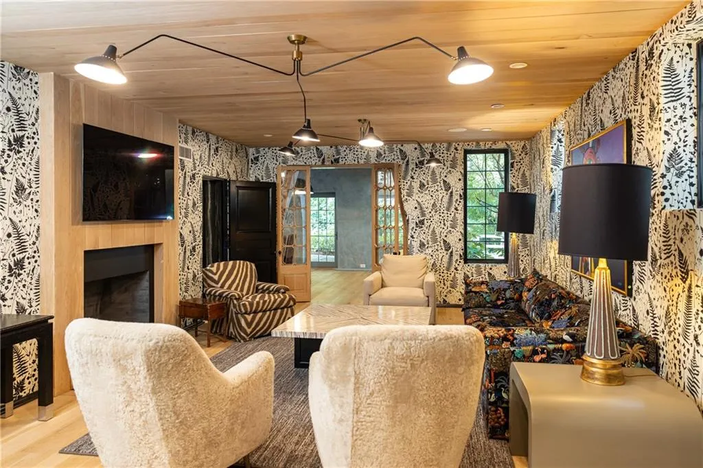 Spacious terrace-level living area features a fireplace and plenty of room for family and guests.