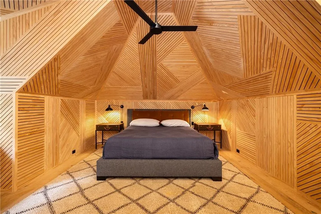 Vaulted wood-paneled ceiling and beautiful architectural lines make this bedroom truly one of a kind.