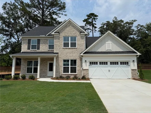 Two-story brick exterior with a welcoming covered front porch