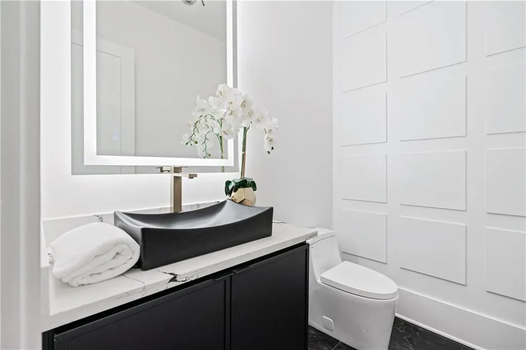 Bathroom featuring vanity and toilet Bathroom featuring vanity and toilet