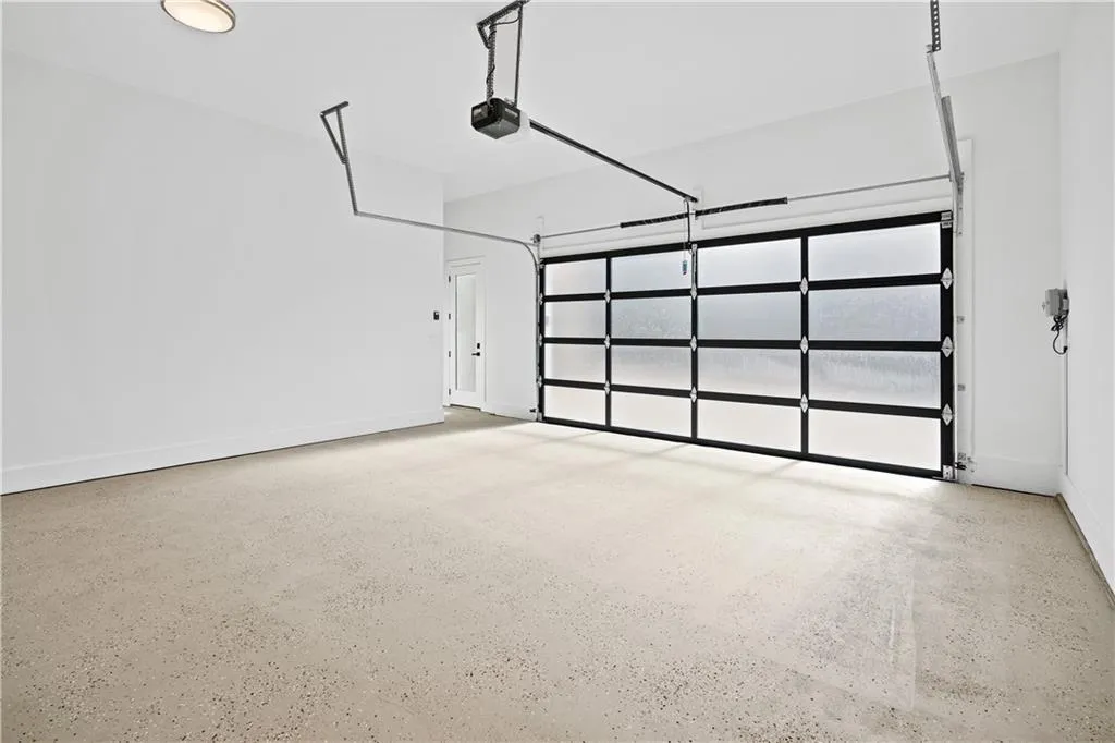 Garage featuring a garage door opener Garage featuring a garage door opener