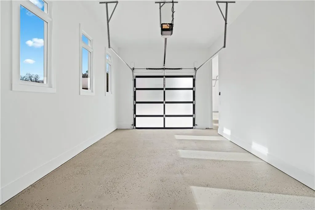 Garage featuring a garage door opener Garage featuring a garage door opener