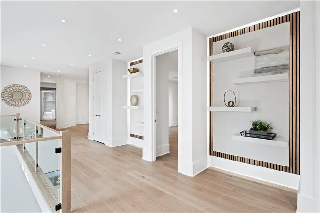 Corridor with light hardwood / wood-style floors Corridor with light hardwood / wood-style floors
