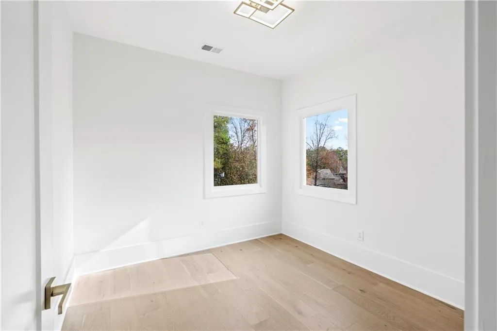 Empty room featuring light wood-type flooring Empty room featuring light wood-type flooring