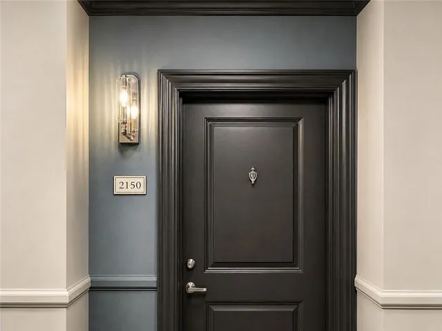Welcome Home! Panel door with decorative trim and contrasting wall colors
