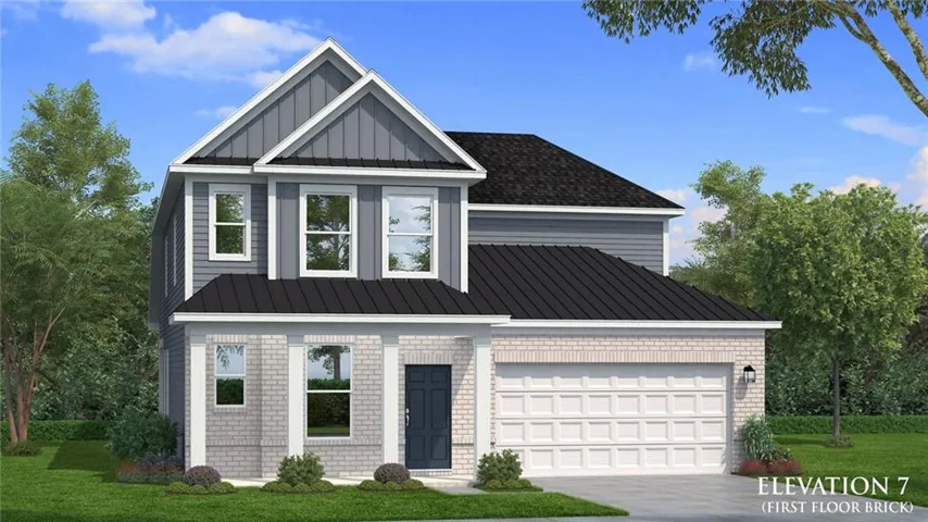Contemporary two-story exterior featuring a gray brick first floor and gray horizontal siding