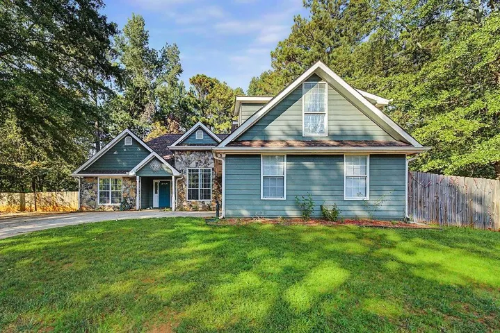 Stone and siding exterior with gabled roof lines