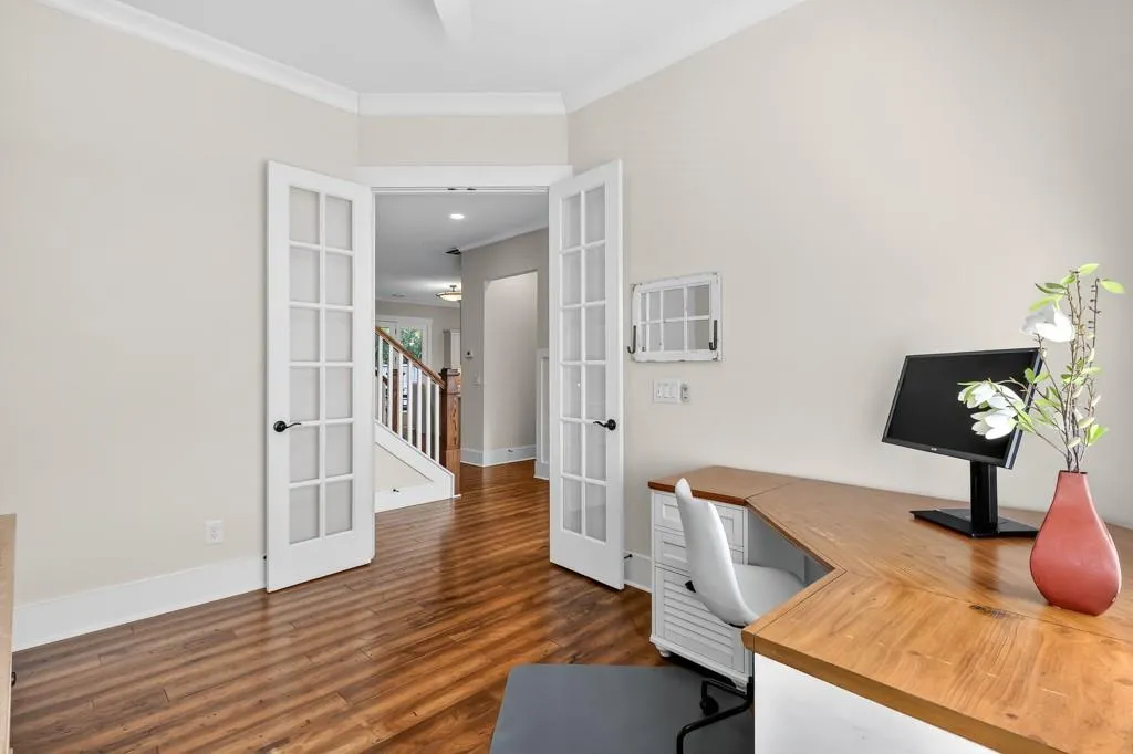 Office featuring ornamental molding, french doors, dark wood-style floors, and ceiling fan