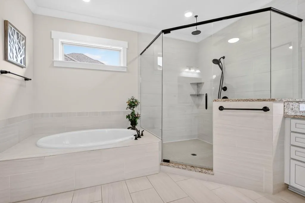 Full bath with a shower stall, a bath, and vanity