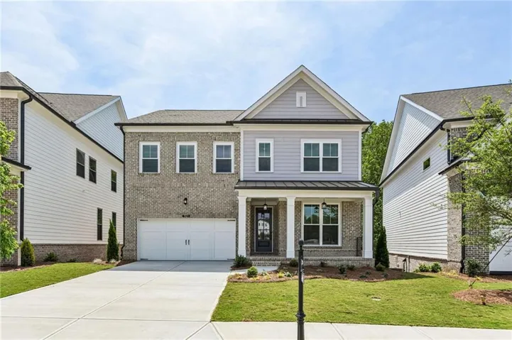 Welcome to the Wesley - homesite 127.   The Wesley floorplan offers a covered front porch elevation with front facing garage. Full unfinished basement.