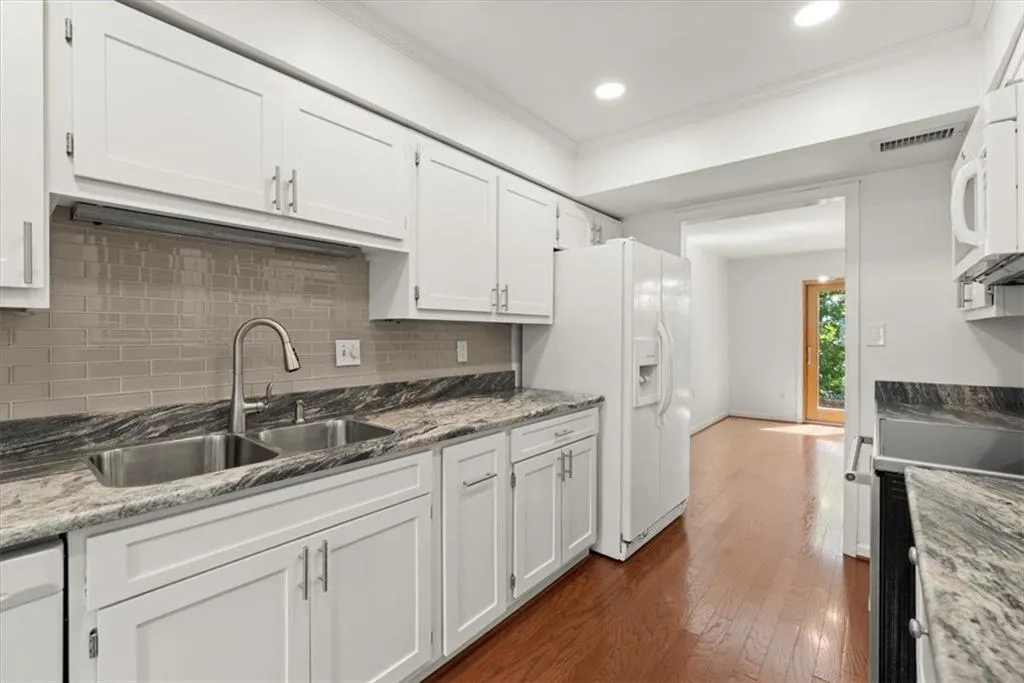 Kitchen with leathered granite counters