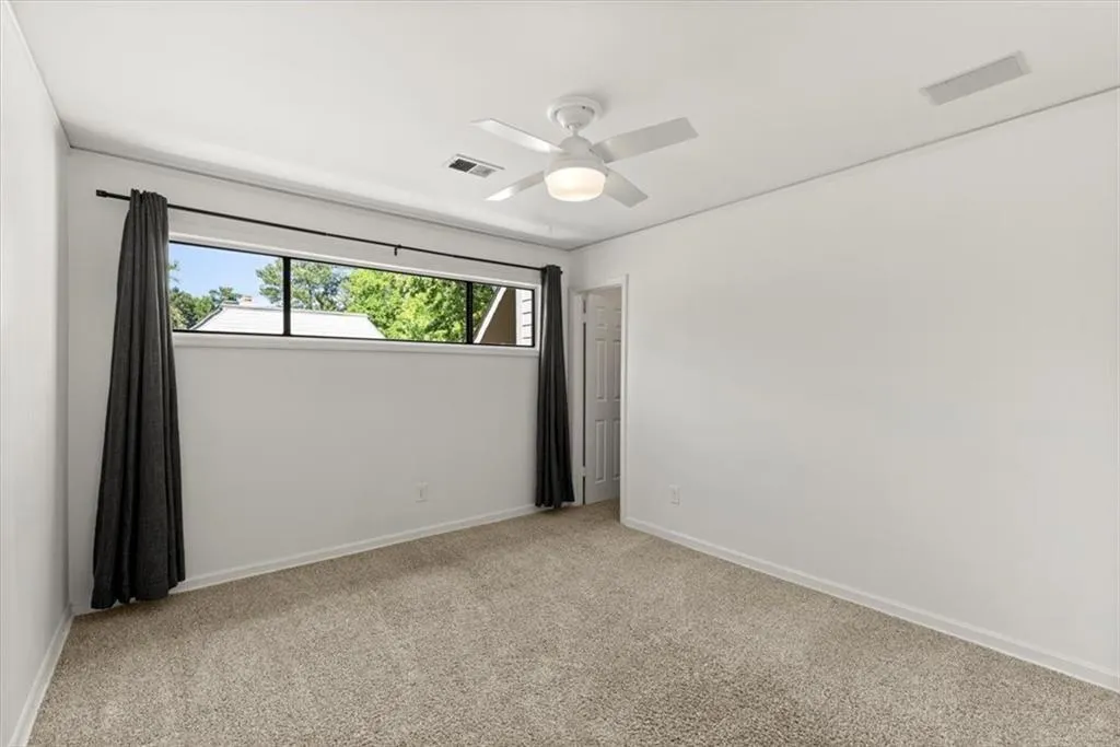 Secondary bedroom with walk in closet