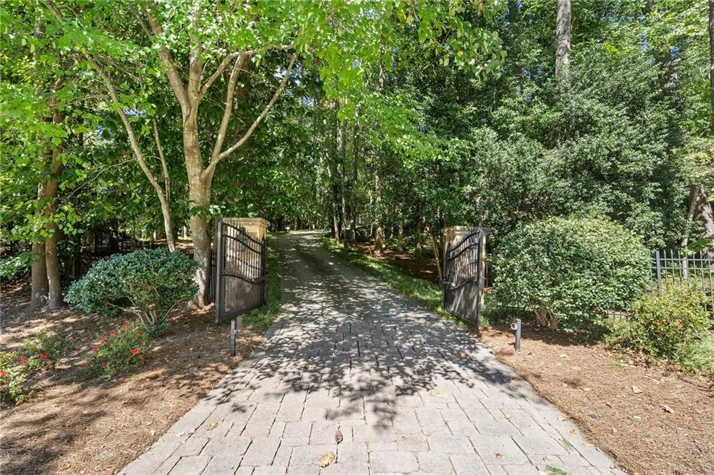 Gated and private 2 acres perfectly set back on this cul de sac street.
