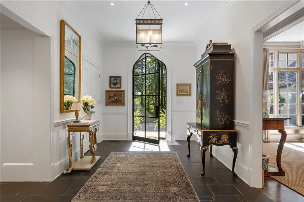 New iron door, black stone flooring in foyer, family, dining, kitchen and the rest new hardwood flooring on both levels.