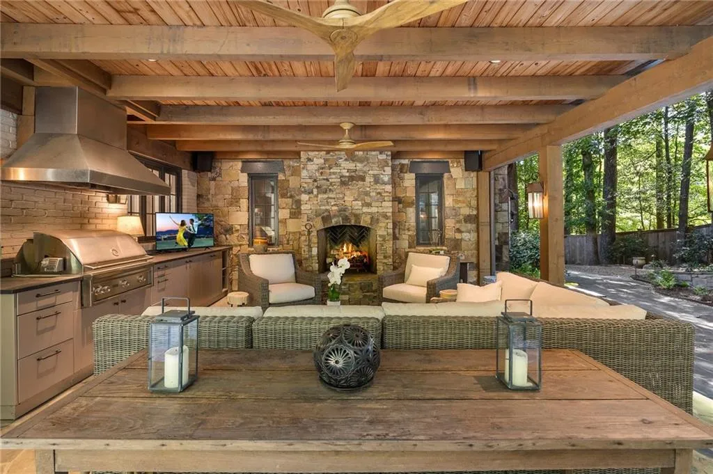 Loggia next to kitchen - amazing entertaining space!  Outdoor kitchen, fireplace, next to Waterfalls!