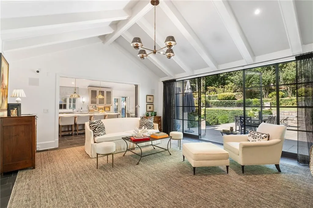 Open to outdoors with new iron doors and open to gorgeous kitchen. This is a WOW!
