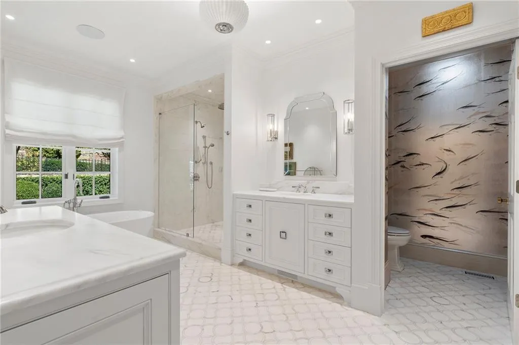 Spa bath. Marble counters and floors, motorized blinds.