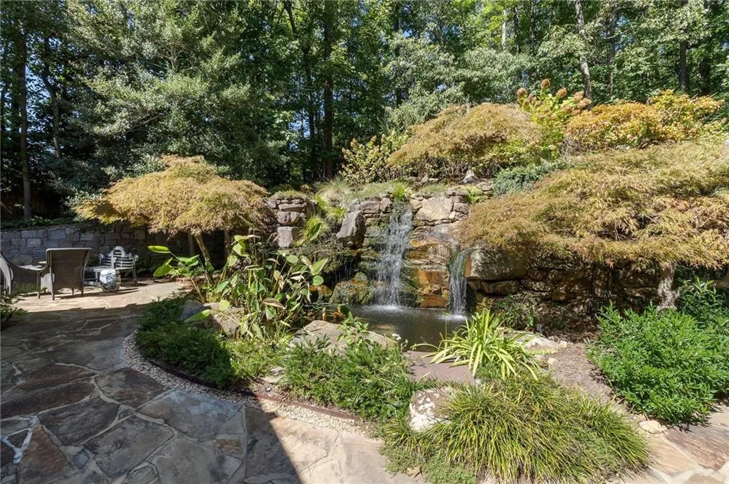 Spectacular Koi pond waterfalls next to loggia.
