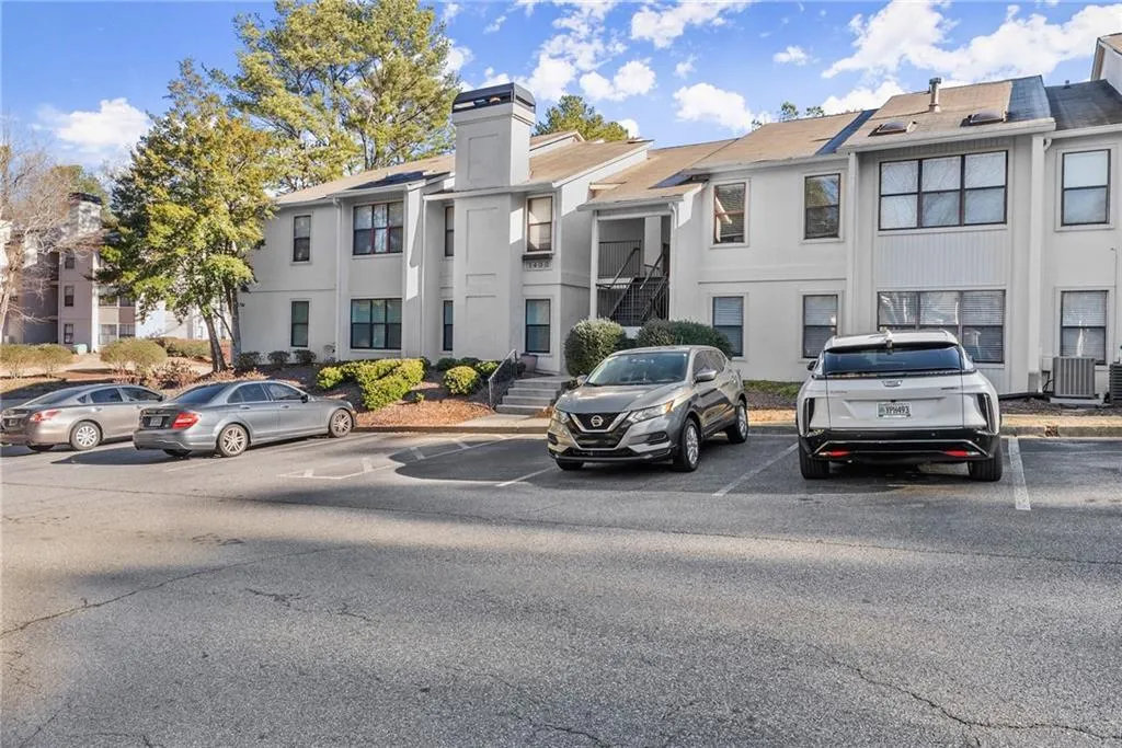 View of property featuring central air condition unit