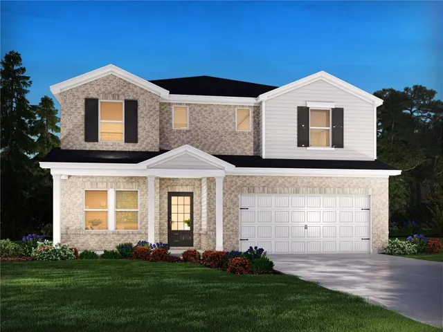 Brick and siding exterior with a covered entry, two-car garage, and established landscaping