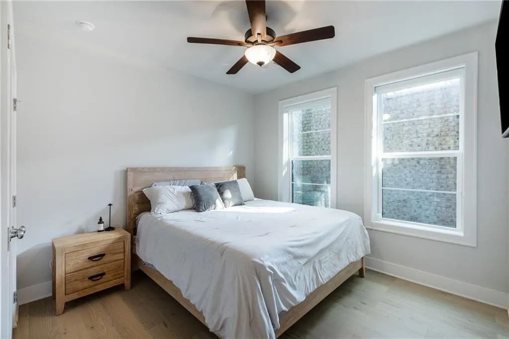 Bedroom featuring wood finished floors and ceiling fan