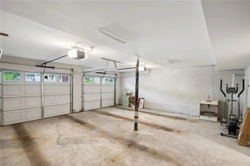 Garage featuring a garage door opener