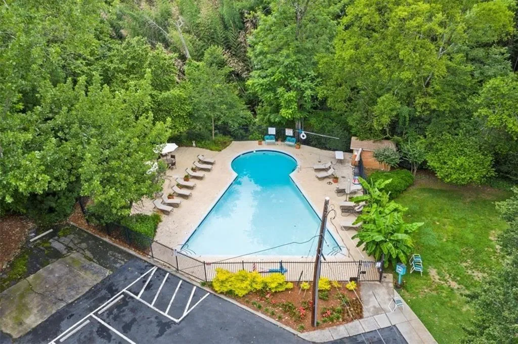 Community pool with a patio area
