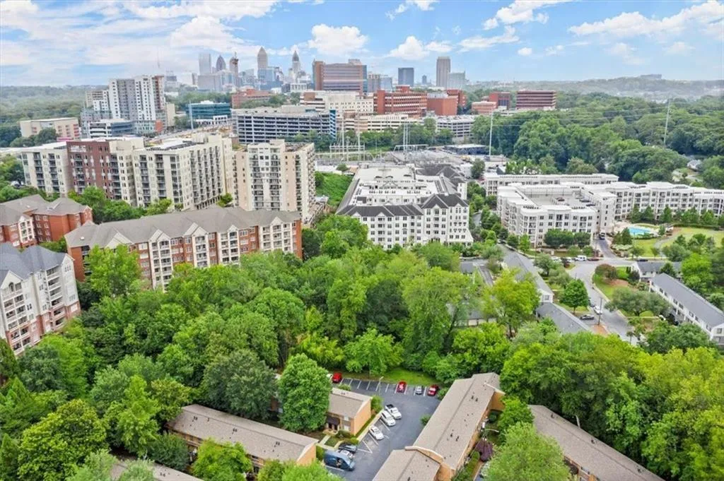 Aerial view of city skyline and a tree filled landscape