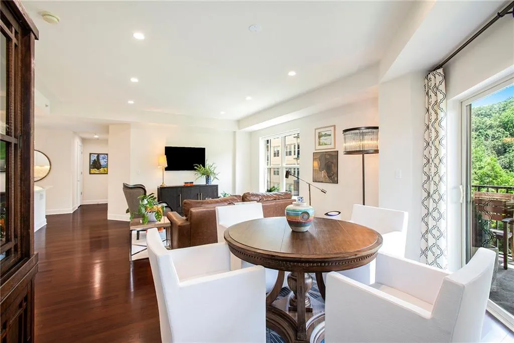 Dining room with dark hardwood / wood-style floors