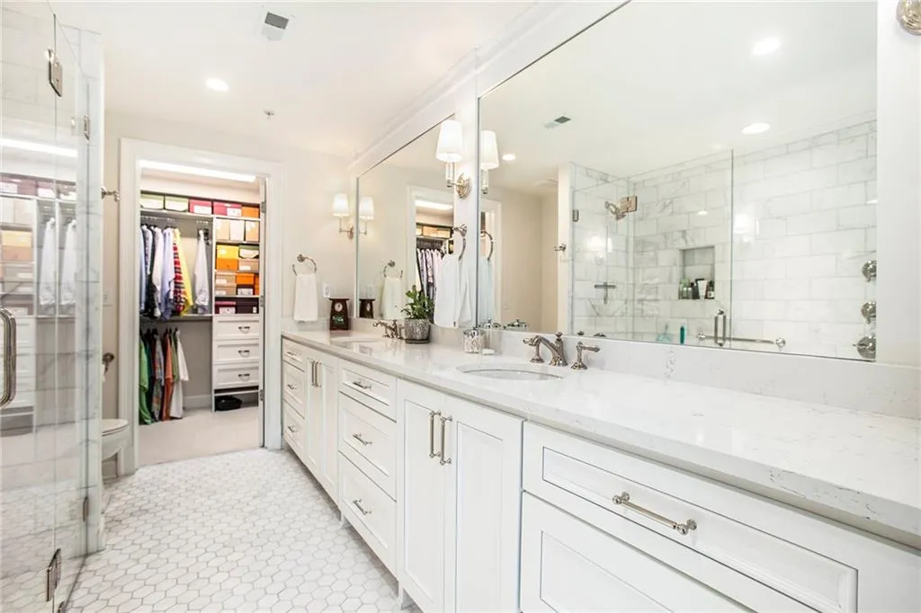 Bathroom with vanity, an enclosed shower, tile patterned flooring, and toilet