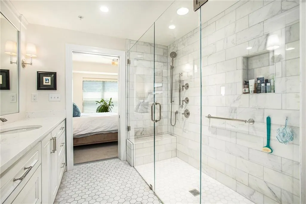 Bathroom with vanity, tile patterned floors, and walk in shower