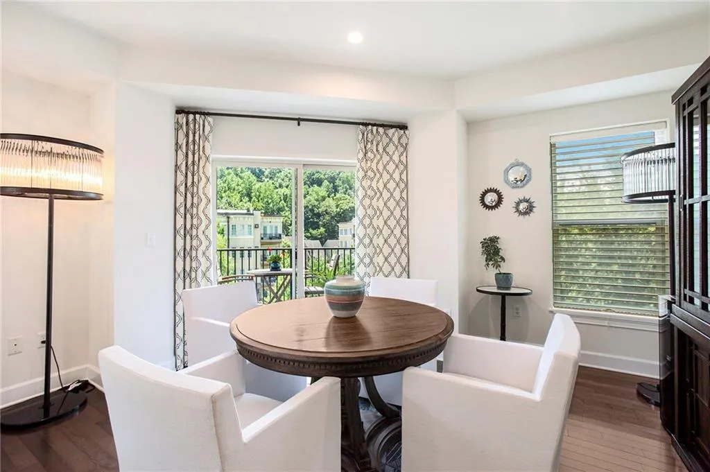 Dining space featuring a wealth of natural light and wood-type flooring
