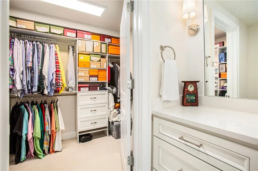 Spacious closet with light colored carpet