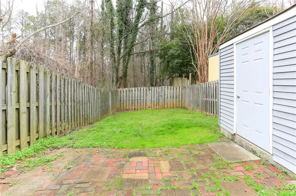 Fenced backyard with storage shed