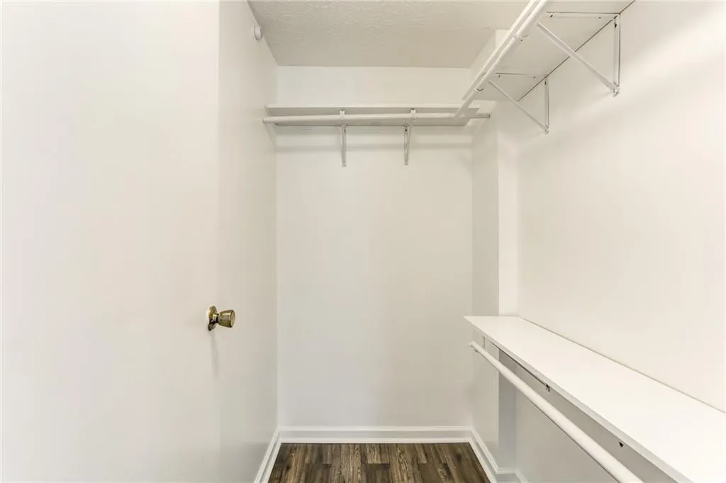 Walk-in closet in primary bedroom