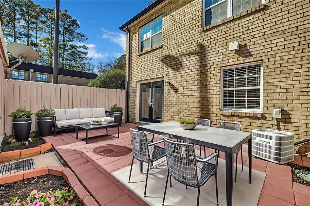 View of patio featuring outdoor dining space and outdoor lounge area
