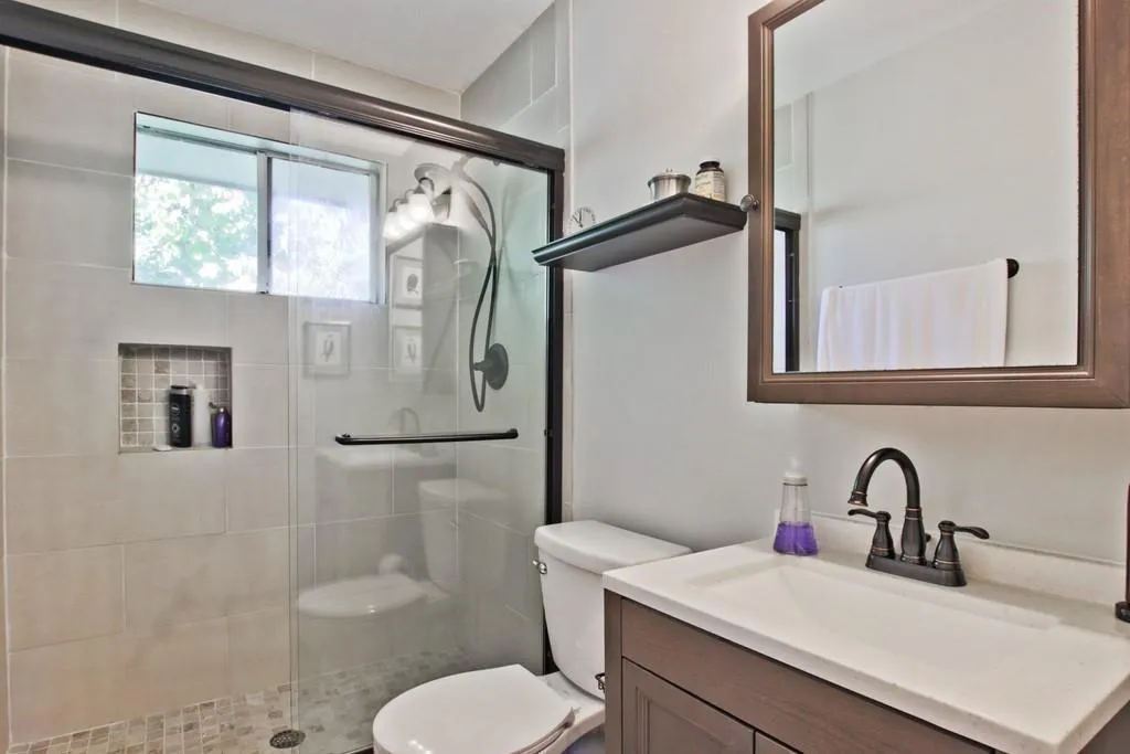 Full bath featuring vanity and a stall shower