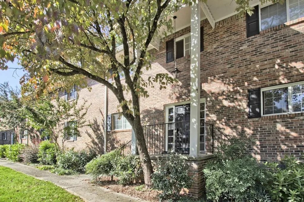 View of side of property with brick siding