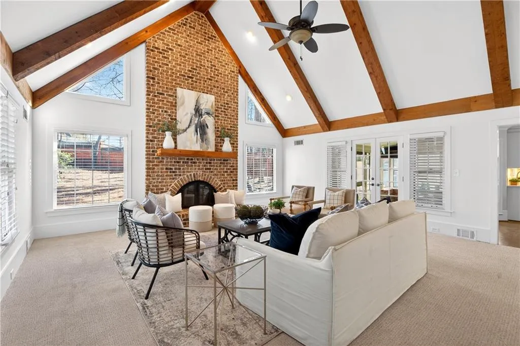 Vaulted Great Room with Back Staircase.