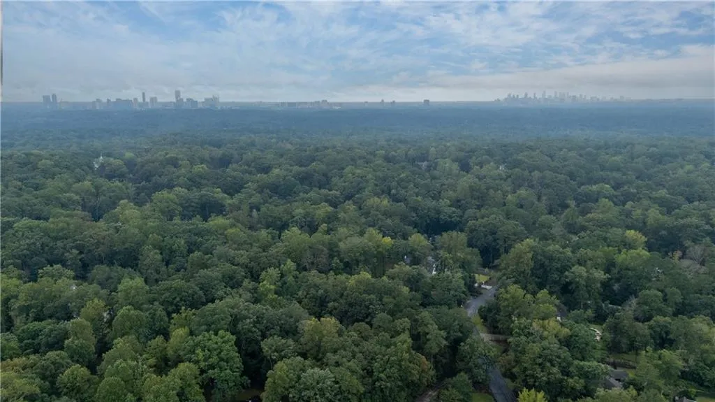 Aerial view of city skyline featuring neighborhood of property