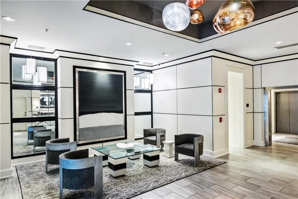 Lobby with a decorative wall and recessed lighting