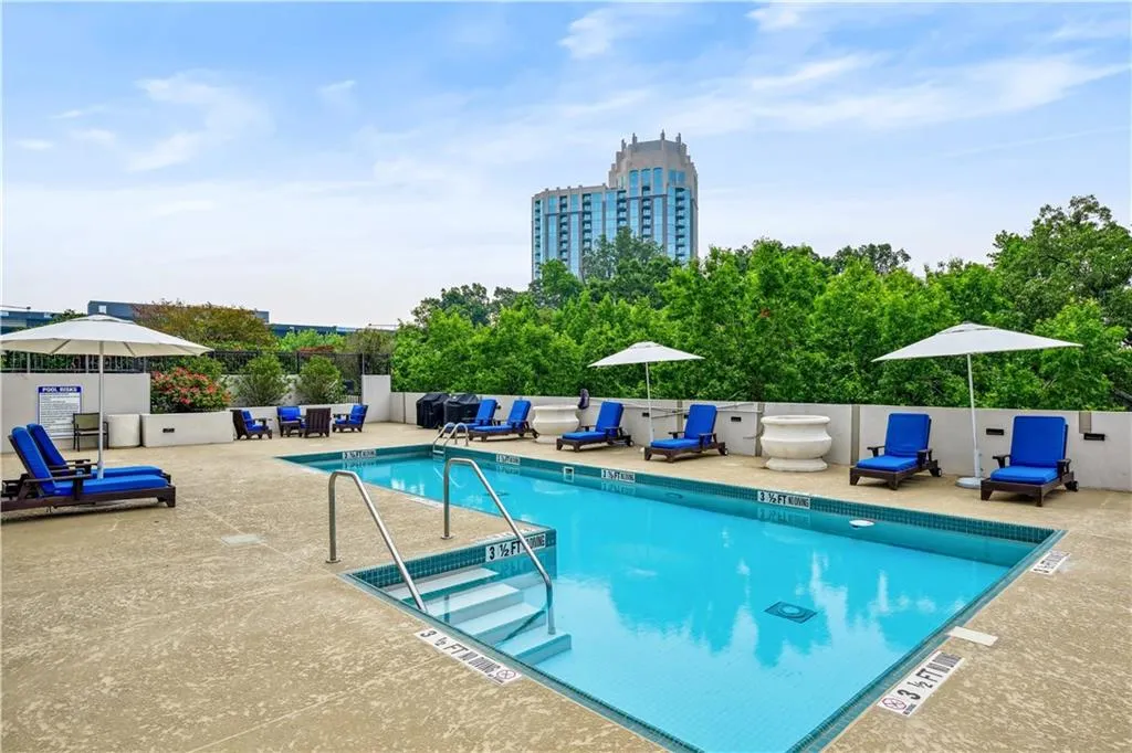 Community pool with a patio