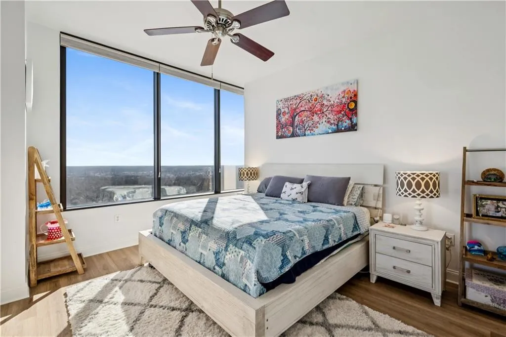 Bedroom featuring a ceiling fan and wood finished floors