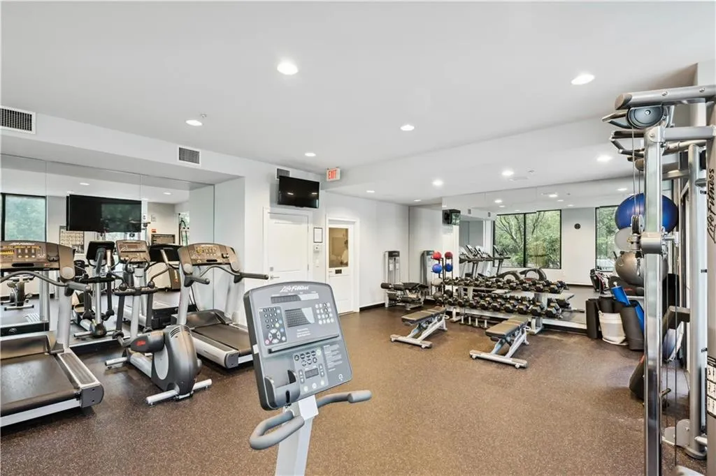 Exercise room featuring recessed lighting